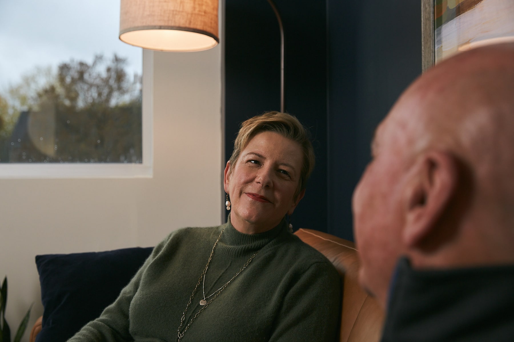 woman smiling at man in therapy session
